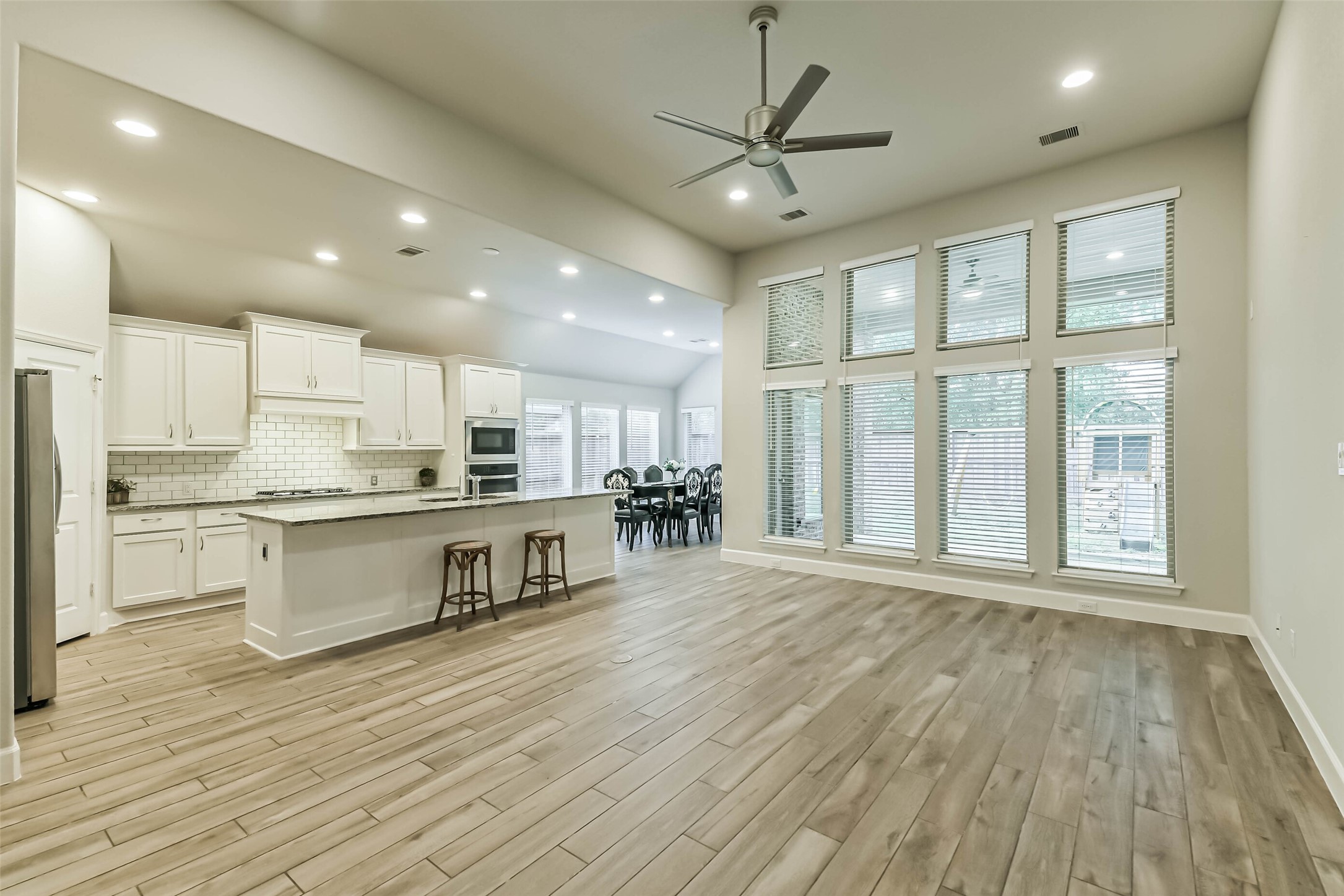 8132 Tyrell Hgts Road Magnolia, TX 77354 - Photo 8 of 40 Wood-like tile floors in living areas and kitchen.