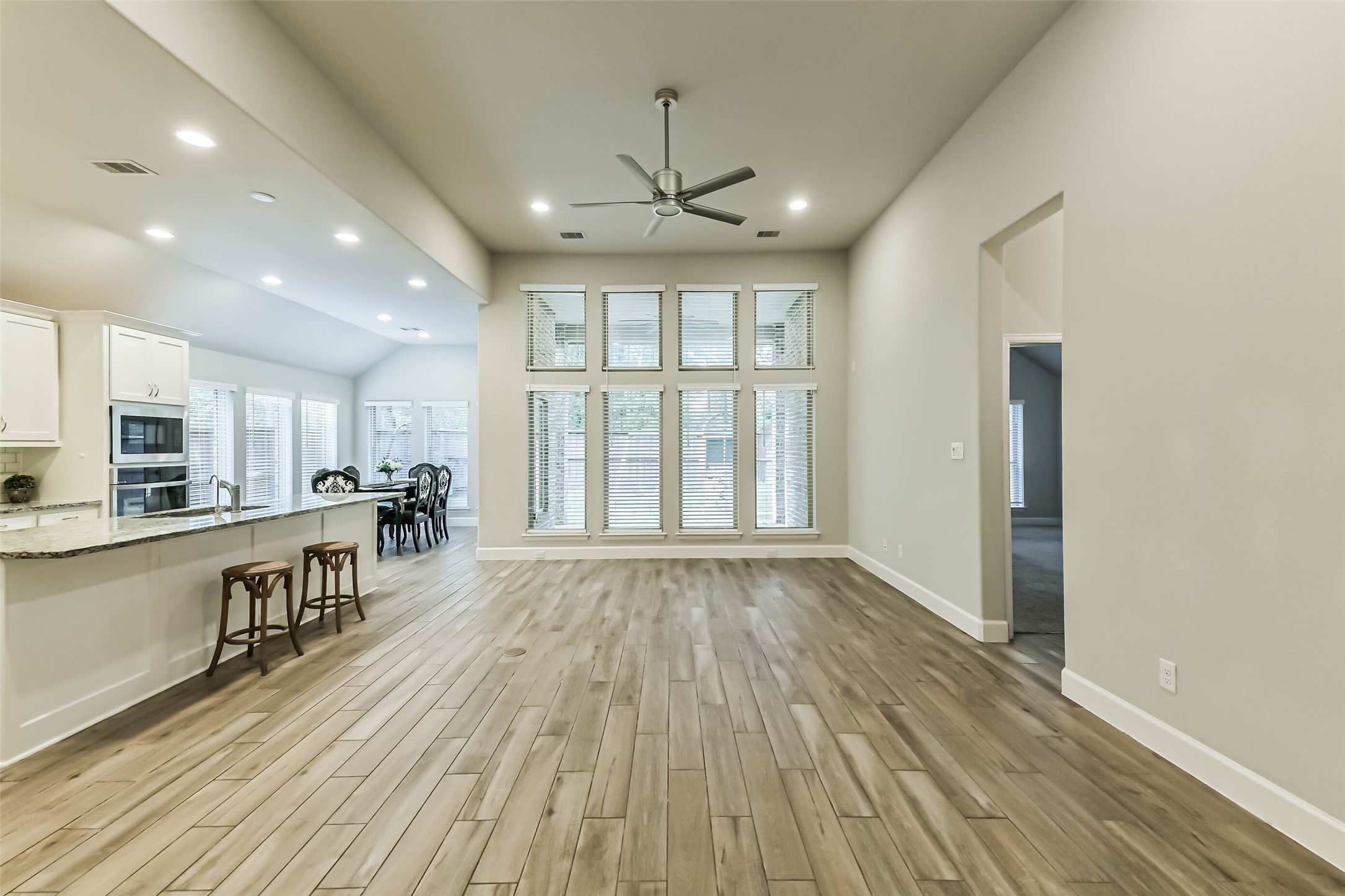 8132 Tyrell Hgts Road Magnolia, TX 77354 - Photo 9 of 40 Family room features wall of windows.