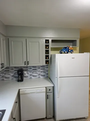 a hallway with washer and dryer