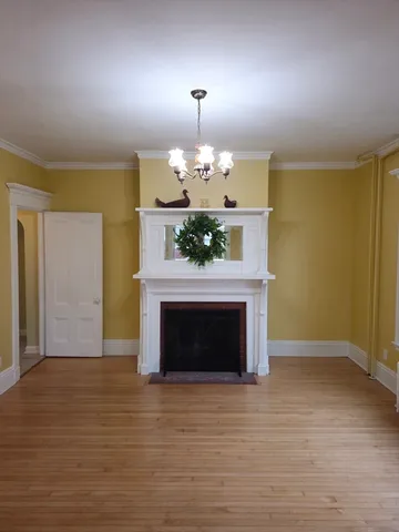 a view of a room with window wooden floor and windows