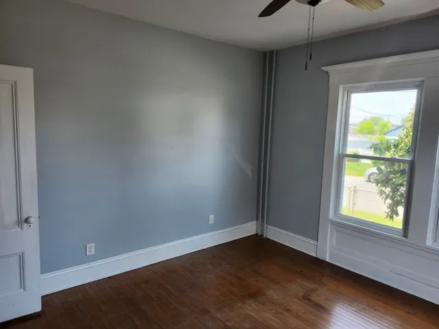 a bedroom with furniture and a rug