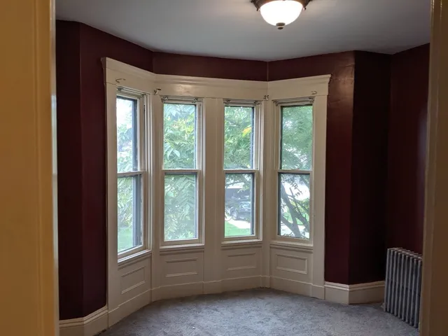 a view of entryway with wooden floor and stairs
