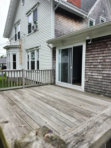 a kitchen with a stove sink and cabinets