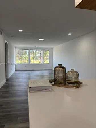 a room with two chairs and a wooden floor