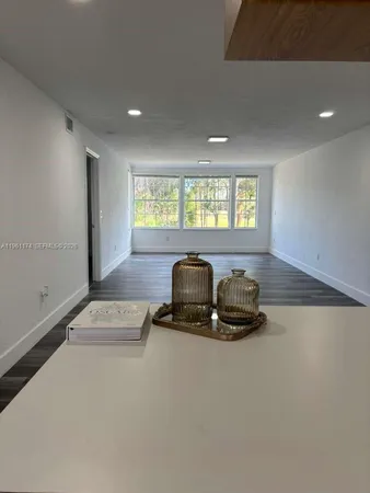 a room with gym equipment and a window