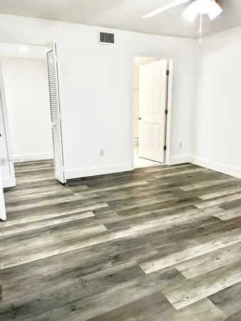 a view of a livingroom with wooden floor