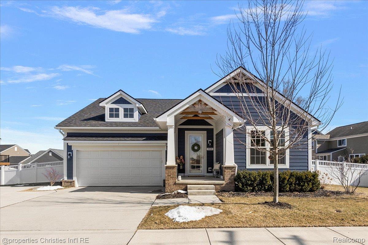 913 Ridge Road South Canton, MI 48188 - Photo 2 of 51 Craftsman inspired home with concrete driveway, an attached garage, and a shingled roof