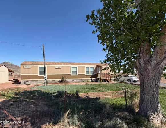 a view of a house with a big yard
