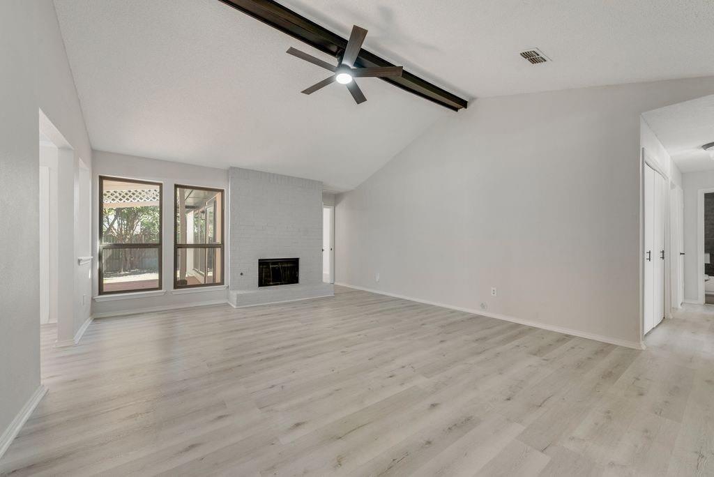 3510 Jonquil Lane Rowlett, TX 75089 - Photo 11 of 35 a view of an empty room with wooden floor and a window