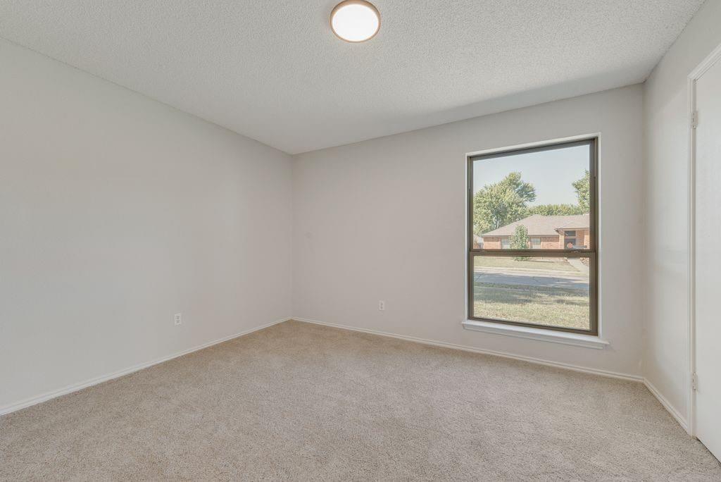3510 Jonquil Lane Rowlett, TX 75089 - Photo 21 of 35 an empty room with windows