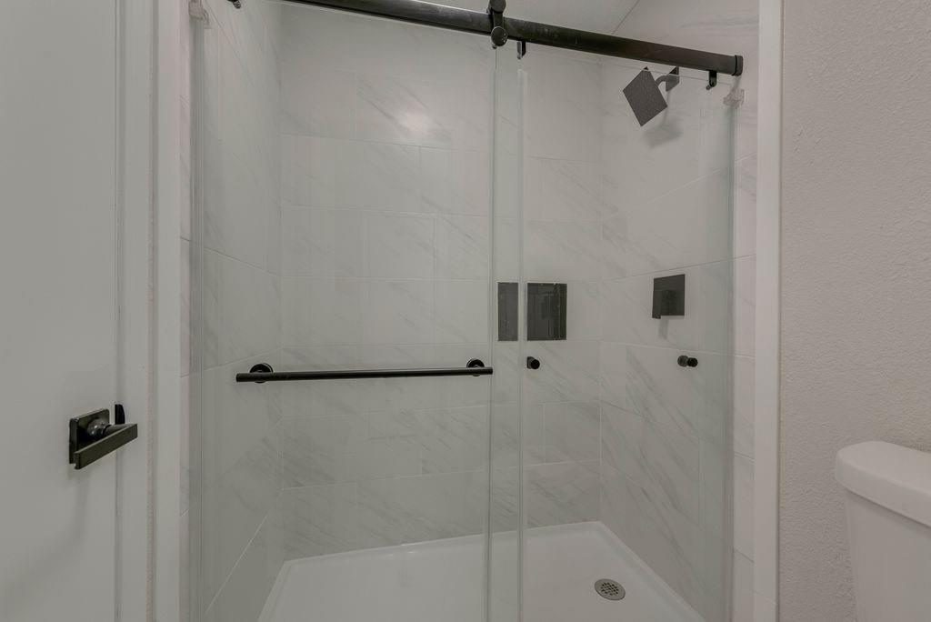 3510 Jonquil Lane Rowlett, TX 75089 - Photo 23 of 35 a bathroom with a shower