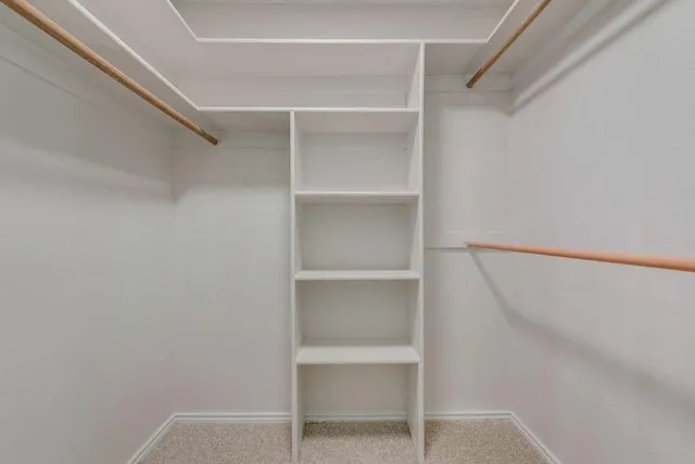 a view of an empty walk in closet