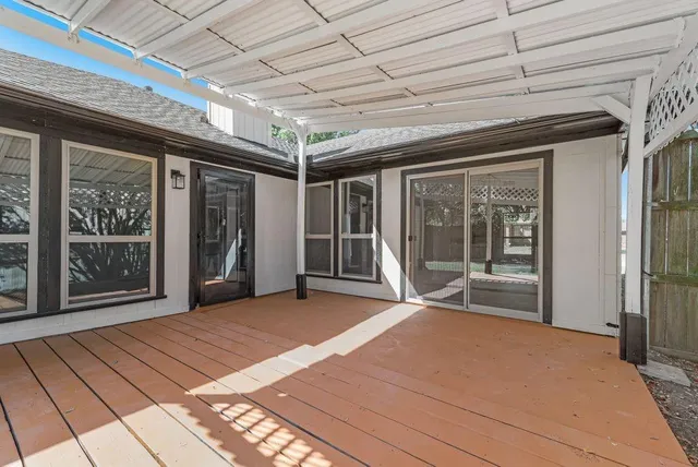 a view of an empty room with a balcony