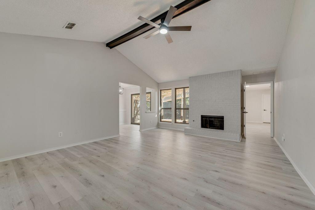 3510 Jonquil Lane Rowlett, TX 75089 - Photo 10 of 35 a view of an empty room with wooden floor and a window
