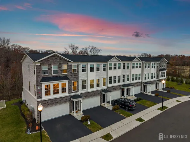 a view of multiple houses with city street