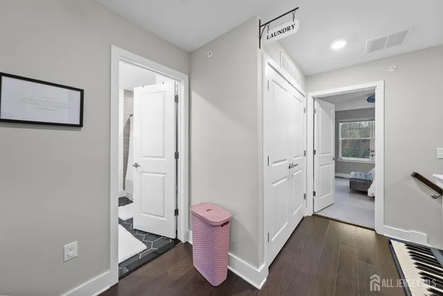 a bathroom with a granite countertop shower sink vanity and mirror