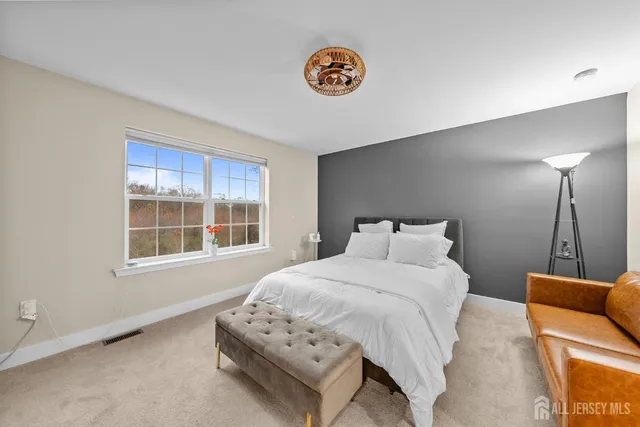 a bathroom with a shower sink and mirror