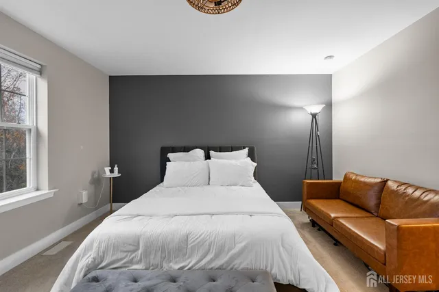 a bathroom with a double vanity sink toilet mirror and bathtub