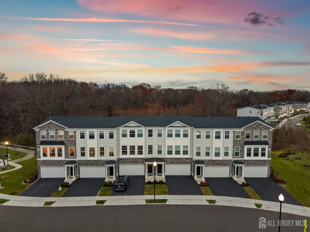 a kitchen with stainless steel appliances granite countertop a refrigerator sink stove and microwave