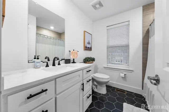 a view of multiple houses with a city street