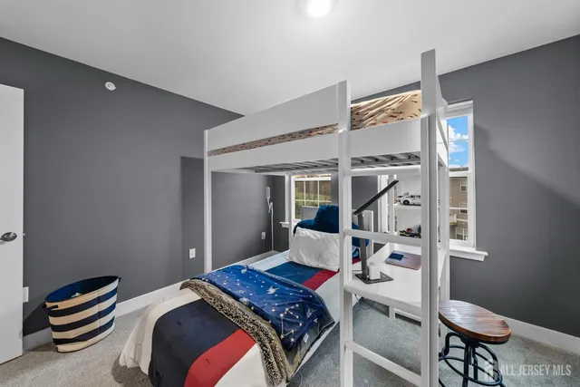 a living room with furniture kitchen view and a fireplace
