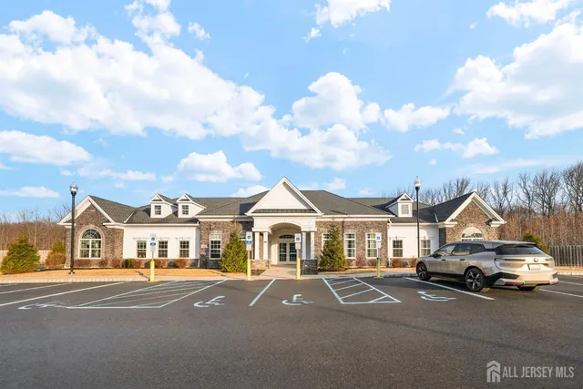 a room with gym equipment and windows