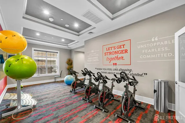 a room with lots of chairs and mirrors