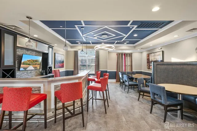 a room with gym equipment and a table