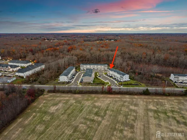 a view of a patio with table and chairs and potted plants