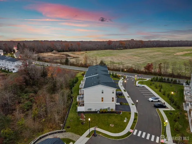 a bathroom with a sink a mirror and shower