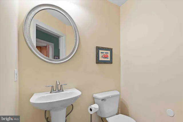 a living room with a table and chairs in it