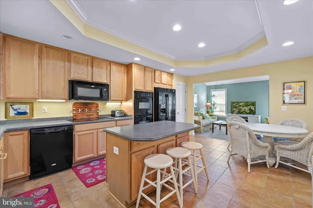 a living room with furniture a window and a table