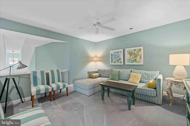 a bedroom with a bed a table and chair