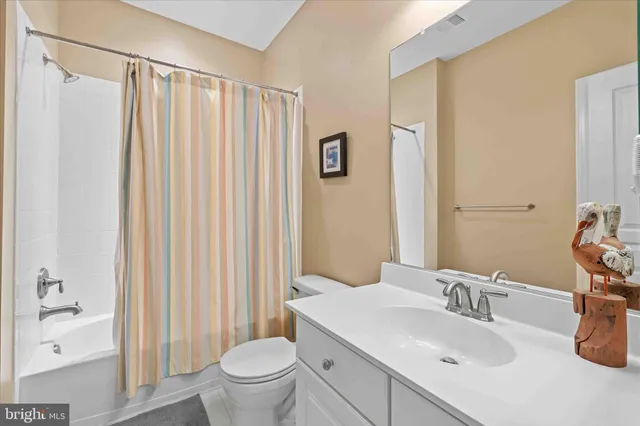 a bedroom with two beds and a window