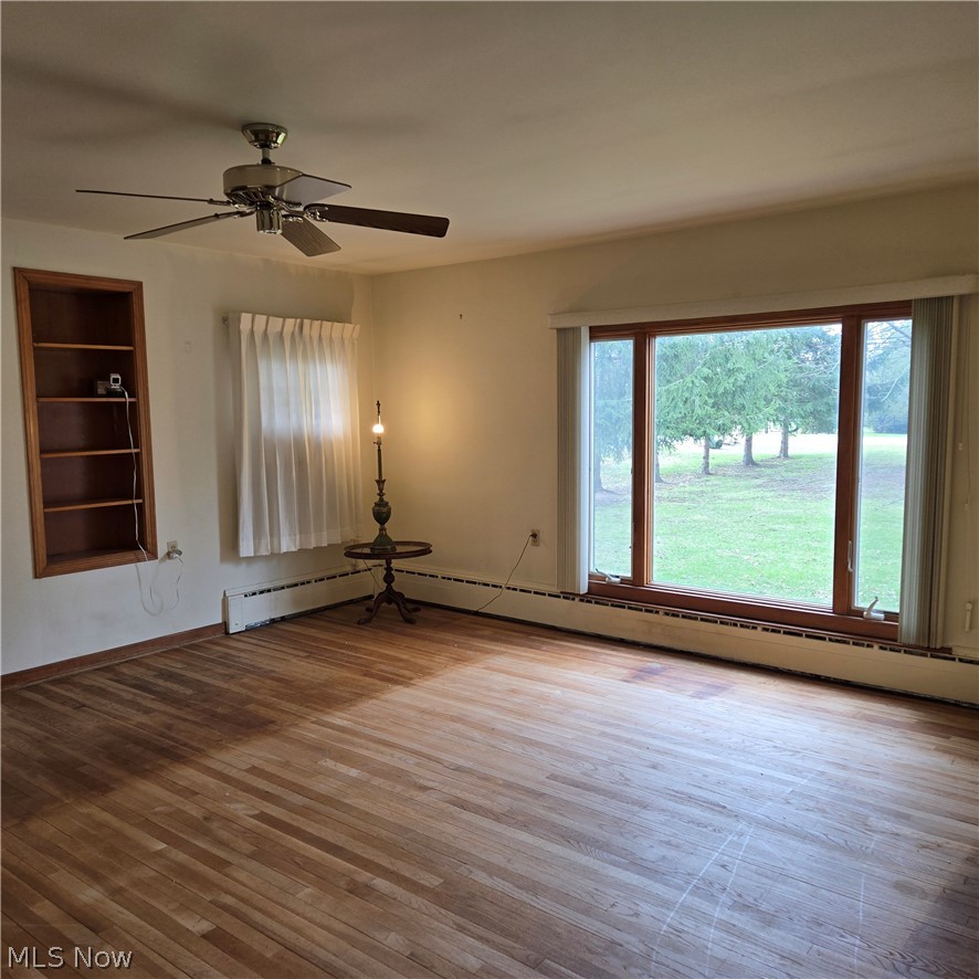 LARGE LIVING ROOM. BEAUTIFUL HARDWOOD FLOORS THROUGHOUT HOME