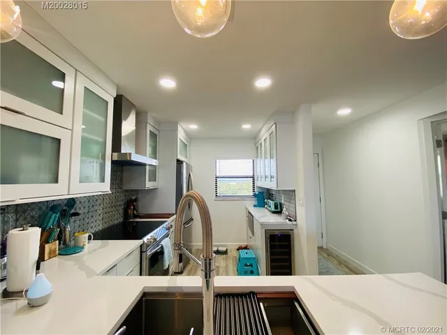 a balcony with chairs and a table