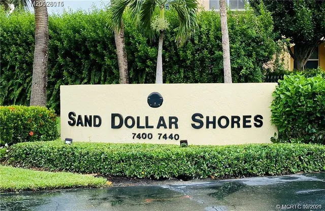 a view of a hallway view with wooden floor and staircase
