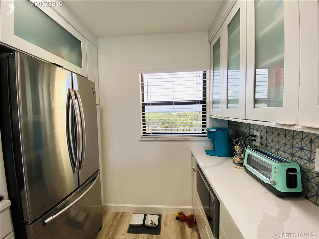 7440 South Ocean Drive, Unit 524A Jensen Beach, FL 34957 - Photo 23 of 64 a utility room with dryer and washer