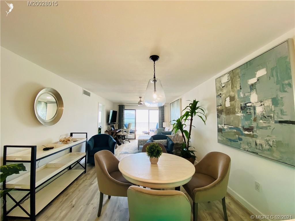 7440 South Ocean Drive, Unit 524A Jensen Beach, FL 34957 - Photo 24 of 64 a living room with dining table and a large window