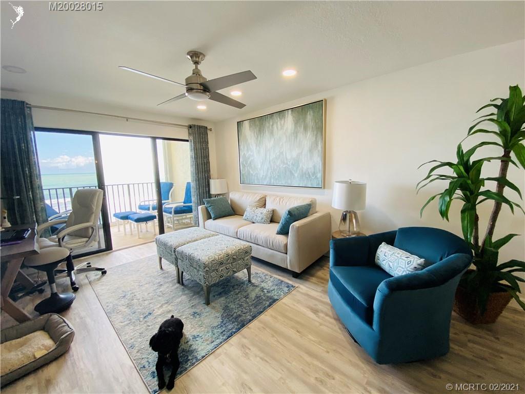 7440 South Ocean Drive, Unit 524A Jensen Beach, FL 34957 - Photo 27 of 64 a living room with furniture rug and window