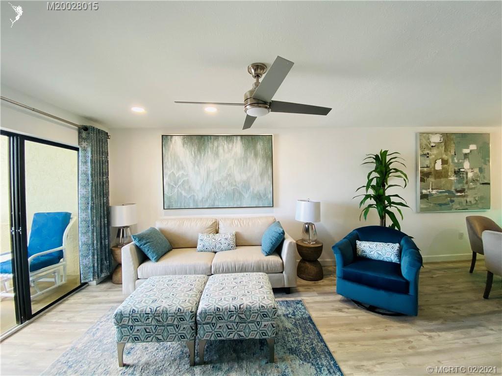 7440 South Ocean Drive, Unit 524A Jensen Beach, FL 34957 - Photo 28 of 64 a living room with furniture and a mirror