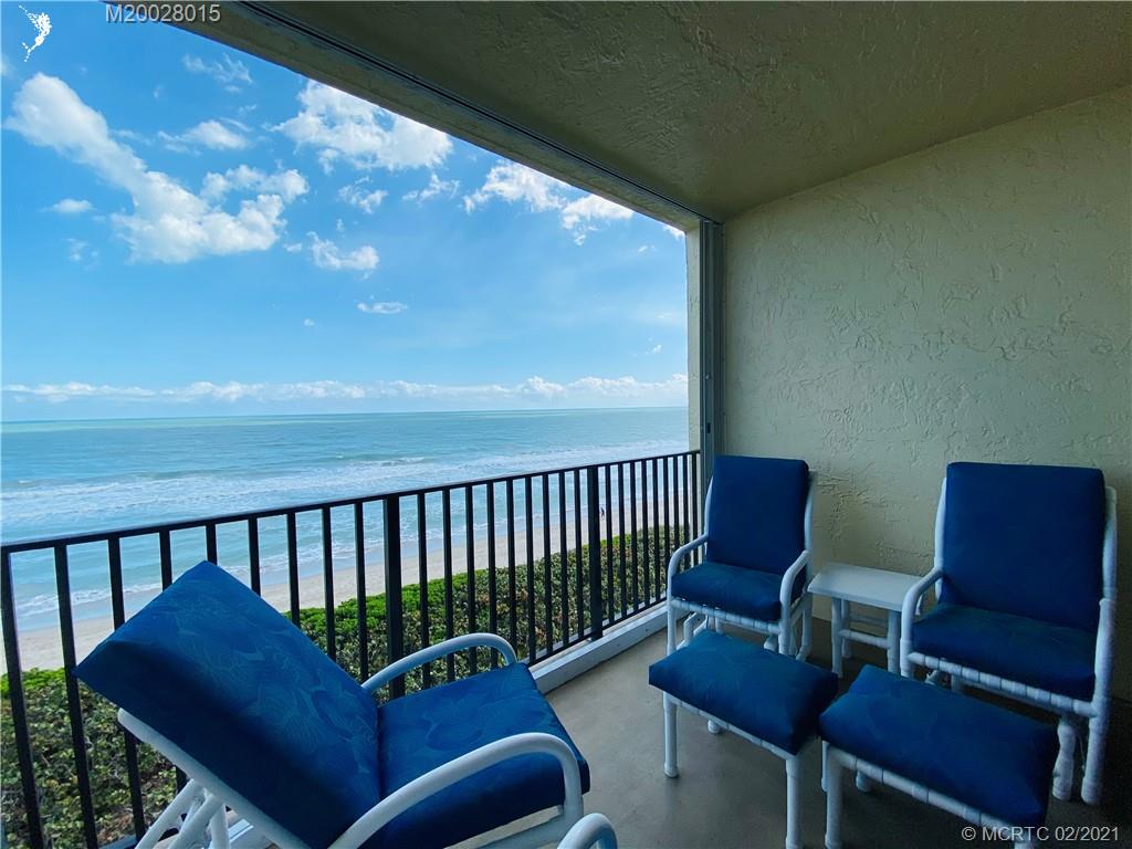 7440 South Ocean Drive, Unit 524A Jensen Beach, FL 34957 - Photo 30 of 64 a balcony with chairs and a table
