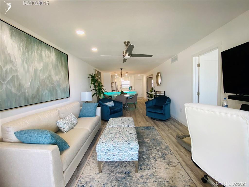 7440 South Ocean Drive, Unit 524A Jensen Beach, FL 34957 - Photo 35 of 64 a living room with furniture and a flat screen tv