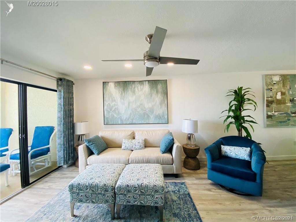 7440 South Ocean Drive, Unit 524A Jensen Beach, FL 34957 - Photo 37 of 64 a bedroom with a bed a couch and a potted plant