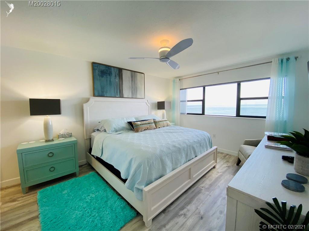 7440 South Ocean Drive, Unit 524A Jensen Beach, FL 34957 - Photo 40 of 64 a bedroom with a bed and a window