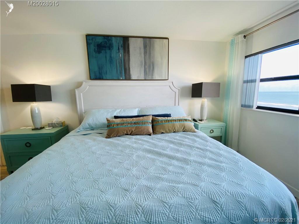 7440 South Ocean Drive, Unit 524A Jensen Beach, FL 34957 - Photo 41 of 64 a bedroom with a bed and a window