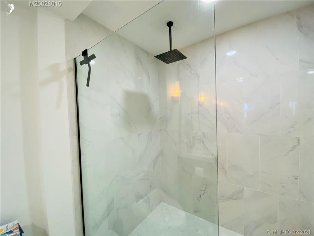 7440 South Ocean Drive, Unit 524A Jensen Beach, FL 34957 - Photo 48 of 64 a bathroom with a shower