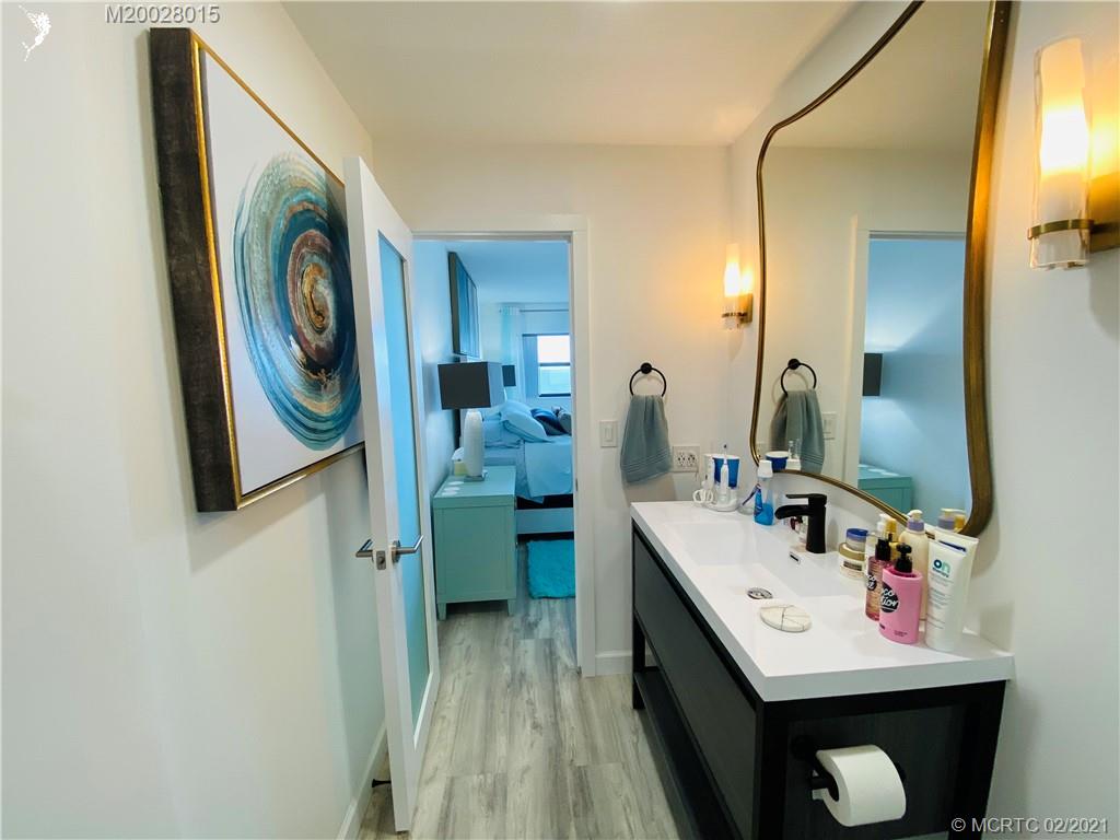 7440 South Ocean Drive, Unit 524A Jensen Beach, FL 34957 - Photo 49 of 64 a bathroom with a sink and a mirror