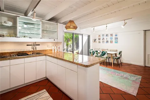 a kitchen with stainless steel appliances granite countertop a sink and cabinets