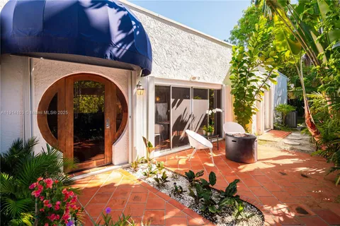a view of a house with tub and a garden